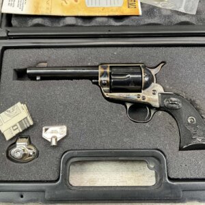 Vintage revolver showcased at Checkpoint Charlie Berlin, symbolizing Cold War history and Berlin Wall era. Iconic weapon associated with East German border security and Cold War espionage.